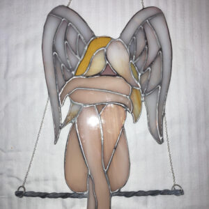 Swinging angel Stunning angel resting on a simple lead came swing